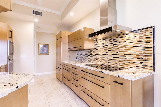 kitchen featuring light brown cabinetry, backsplash, exhaust hood, ornamental molding, and stainless steel oven