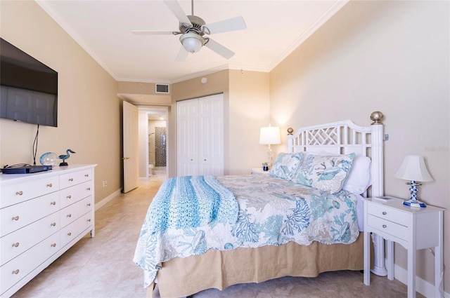 bedroom featuring a closet, ceiling fan, and crown molding