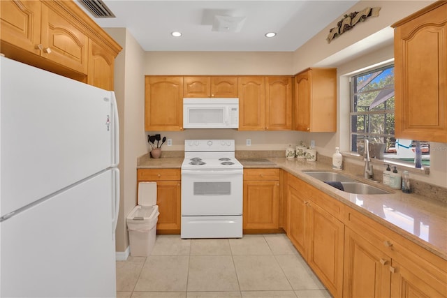 kitchen with recessed lighting, visible vents, light tile patterned flooring, a sink, and white appliances