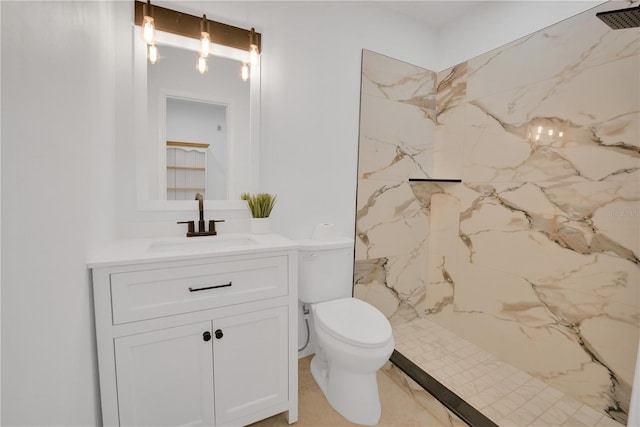 full bathroom featuring toilet, vanity, and a marble finish shower