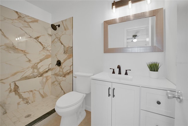 full bathroom featuring a marble finish shower, vanity, and toilet