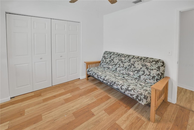 sitting room featuring ceiling fan, baseboards, and wood finished floors