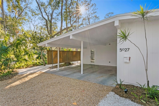 view of vehicle parking with a carport