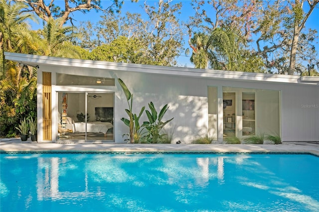 view of swimming pool featuring an outdoor structure