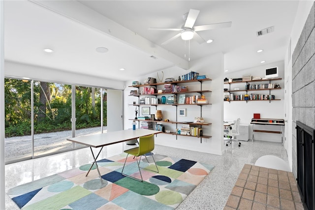 office space with ceiling fan and beam ceiling