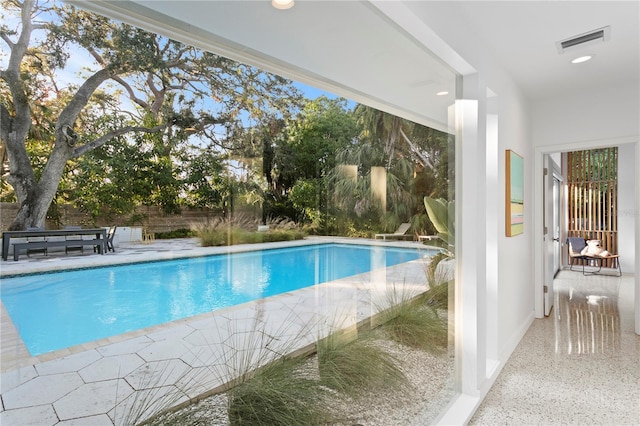 view of pool featuring a patio area