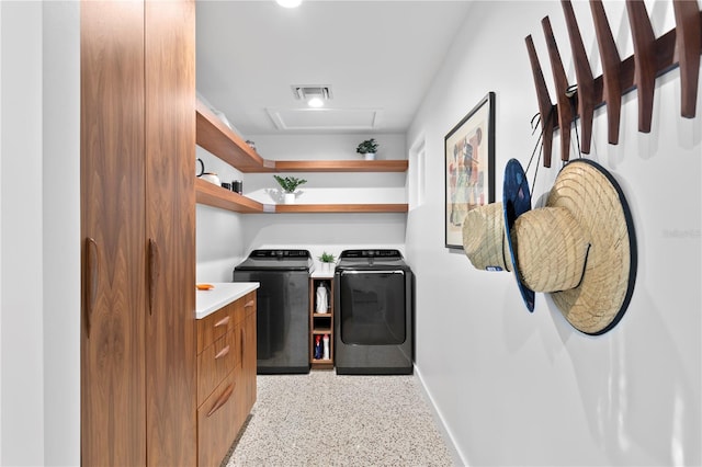 laundry room featuring separate washer and dryer