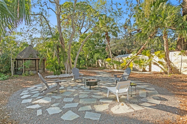 view of patio with a gazebo and an outdoor fire pit