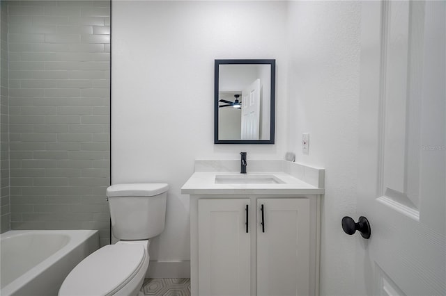 full bathroom with vanity, tiled shower / bath, and toilet