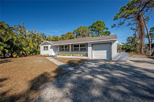 single story home featuring a garage