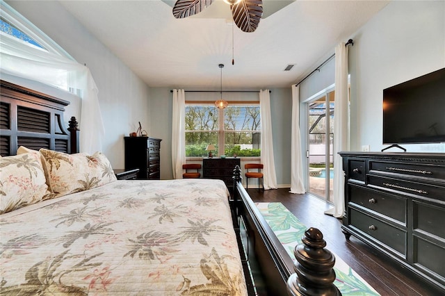 bedroom with ceiling fan, access to outside, and dark hardwood / wood-style flooring