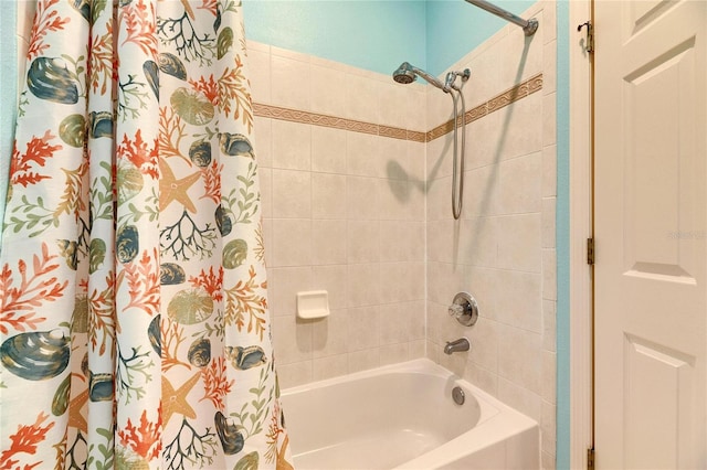 bathroom with shower / bath combination with curtain