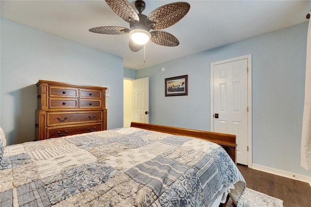 bedroom featuring ceiling fan and dark hardwood / wood-style floors