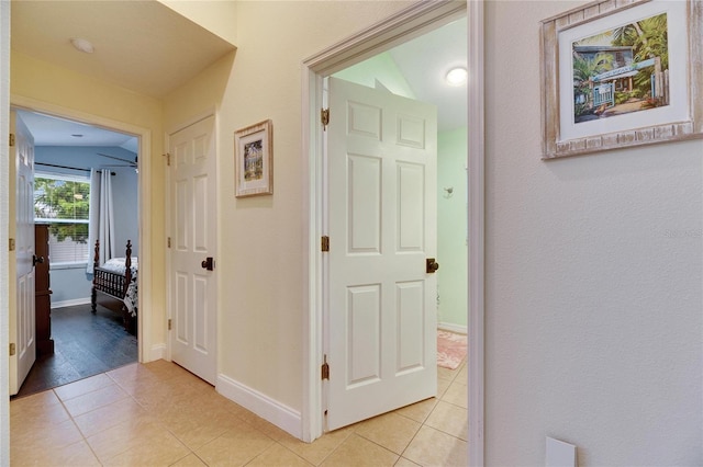 hall featuring light tile patterned flooring