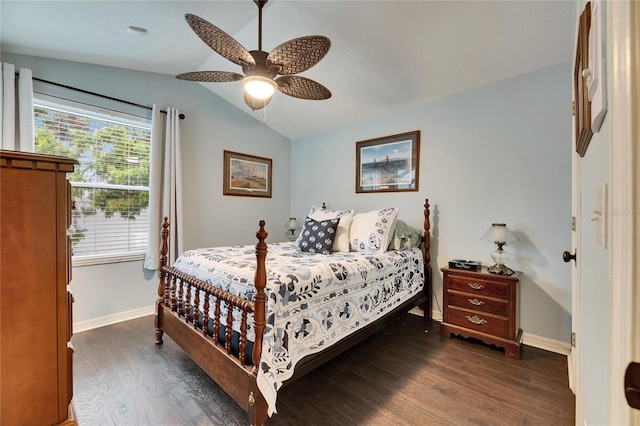 bedroom with ceiling fan, dark hardwood / wood-style floors, and lofted ceiling