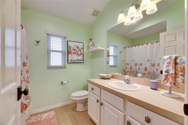 bathroom featuring a notable chandelier, toilet, tile patterned flooring, vanity, and lofted ceiling