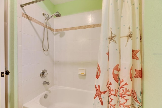 bathroom with shower / tub combo with curtain