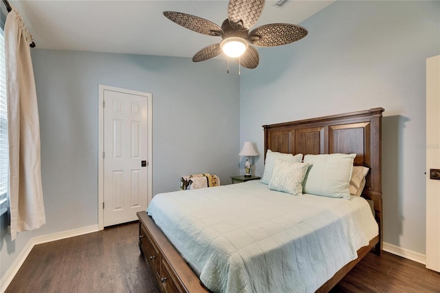 bedroom featuring ceiling fan, dark hardwood / wood-style flooring, and lofted ceiling