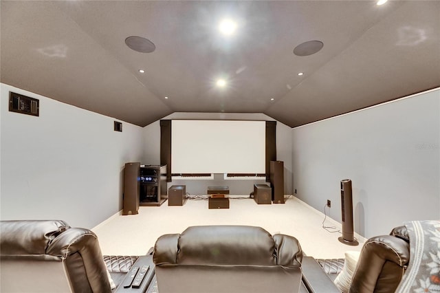 home theater featuring lofted ceiling and carpet flooring