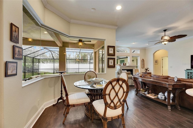 dining space with crown molding, hardwood / wood-style flooring, and ceiling fan