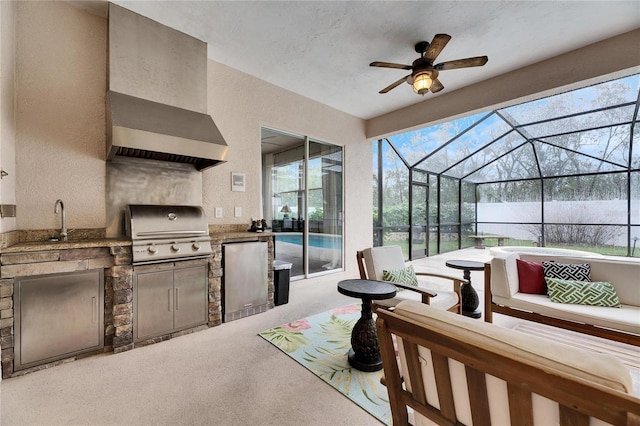 view of patio featuring an outdoor kitchen, area for grilling, sink, a hot tub, and an outdoor hangout area