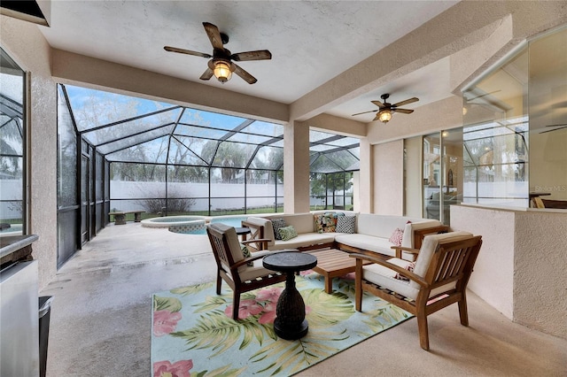 view of patio / terrace featuring glass enclosure, an in ground hot tub, and outdoor lounge area