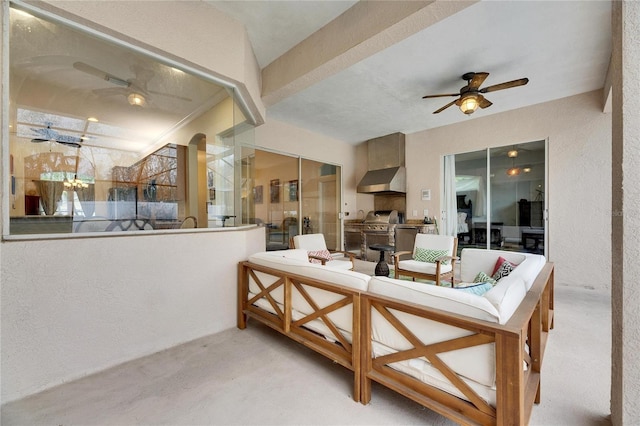 view of patio / terrace featuring an outdoor living space, ceiling fan, and exterior kitchen