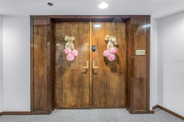 interior details featuring carpet flooring