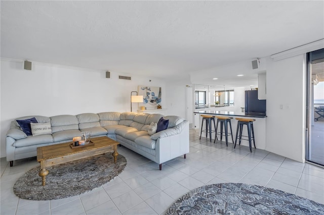 living room featuring light tile patterned flooring