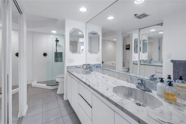 bathroom with walk in shower, vanity, and toilet