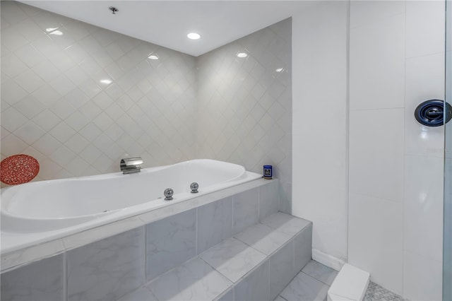 bathroom with tile walls