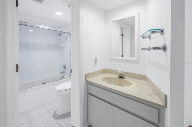 full bathroom with vanity, tile patterned floors, enclosed tub / shower combo, and toilet