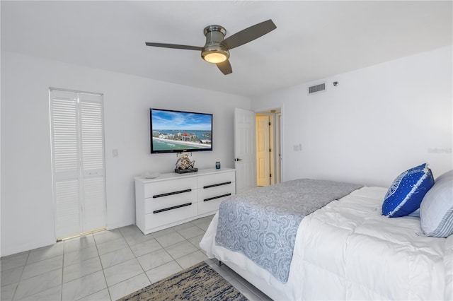 tiled bedroom with ceiling fan