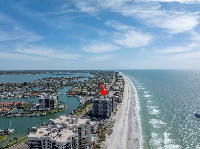 bird's eye view featuring a view of the beach and a water view