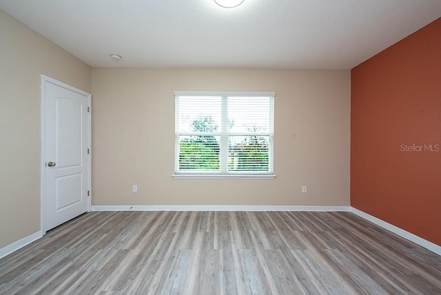 unfurnished room featuring light hardwood / wood-style flooring