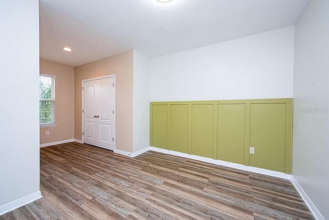 spare room featuring hardwood / wood-style flooring