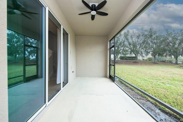 sunroom with ceiling fan and a wealth of natural light