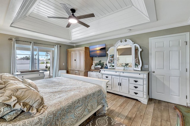 bedroom with ornamental molding, a raised ceiling, ceiling fan, and wood ceiling