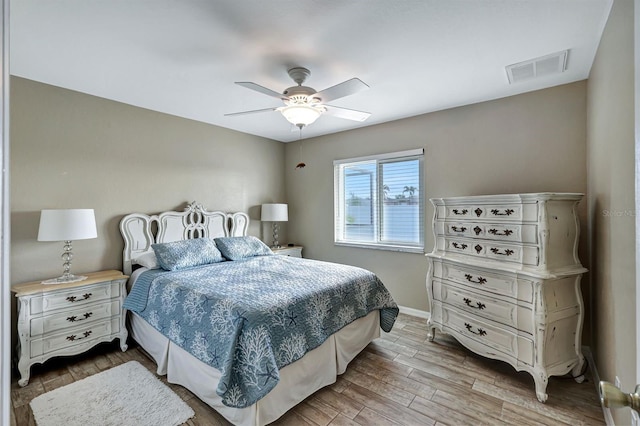 3105 SW 16th Pl, Cape Coral, FL 33914 - bedroom with ceiling fan, baseboards, visible vents, and wood finished floors