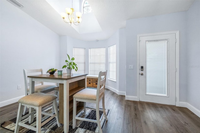 dining room featuring dark hardwood / wood-style flooring and a notable chandelier