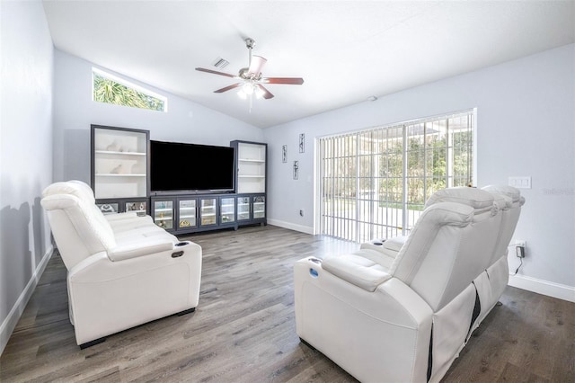 living room with ceiling fan, wood-type flooring, and vaulted ceiling