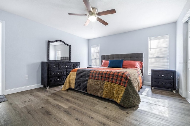 bedroom featuring hardwood / wood-style floors and ceiling fan