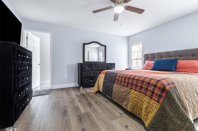 bedroom with hardwood / wood-style flooring and ceiling fan