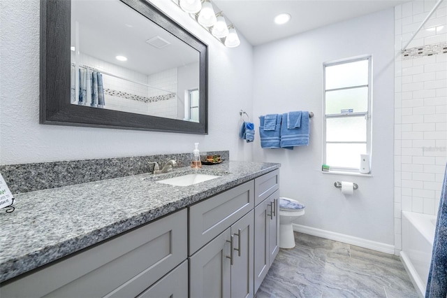 full bathroom featuring vanity, shower / bath combo, and toilet