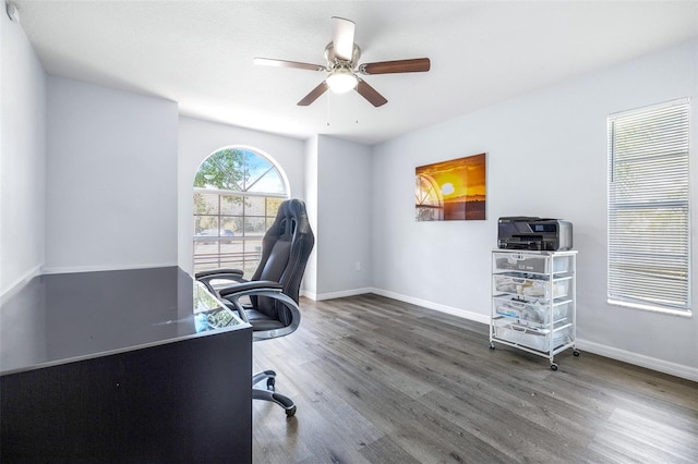 office with ceiling fan and dark hardwood / wood-style flooring