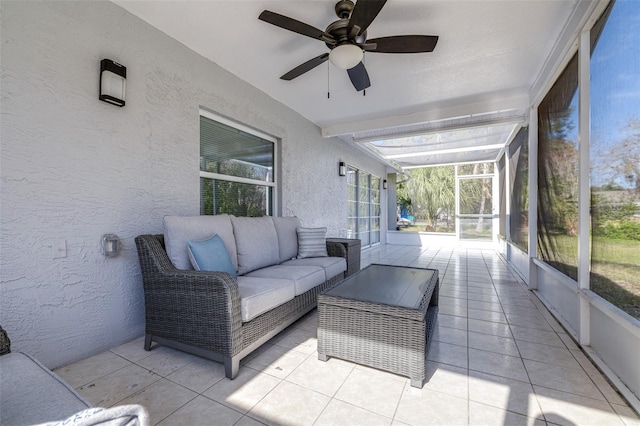 sunroom / solarium with ceiling fan