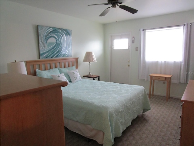 carpeted bedroom with ceiling fan