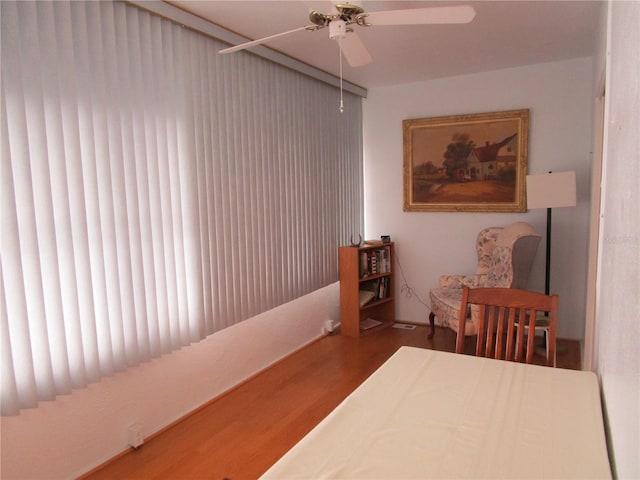 bedroom with hardwood / wood-style flooring and ceiling fan