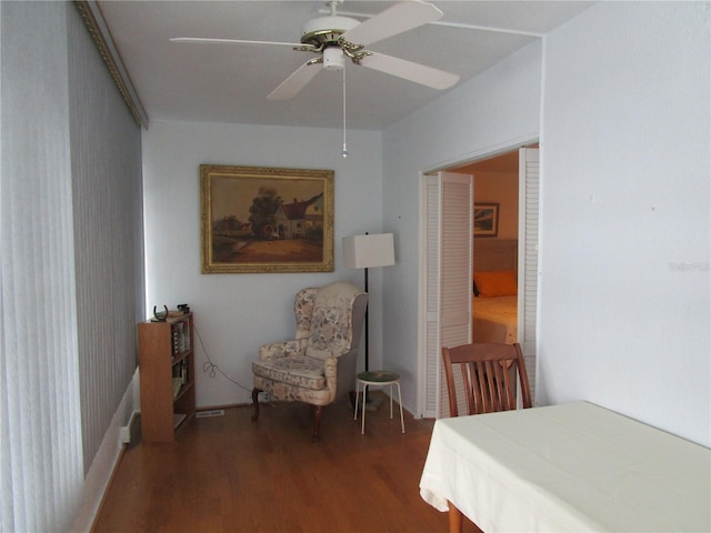 bedroom with ceiling fan and dark hardwood / wood-style flooring