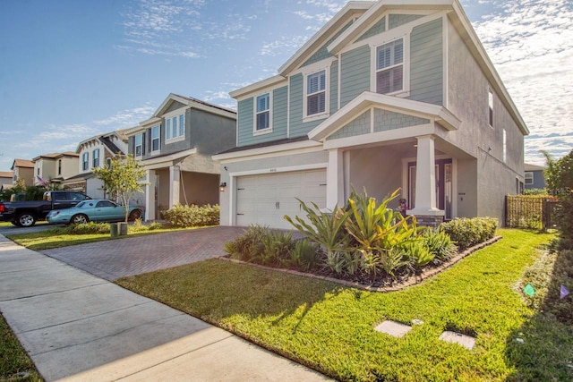 view of front of property with a garage and a front yard